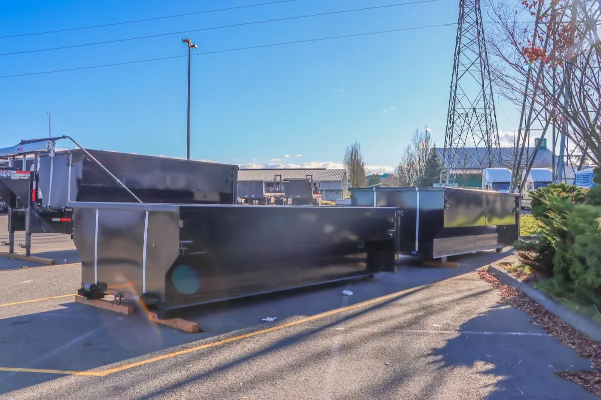 Roll-off dumpster ready for waste disposal at job site for 2 Yard Dumpster Rental in Lamar